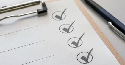 Four checkmarks on a piece of paper