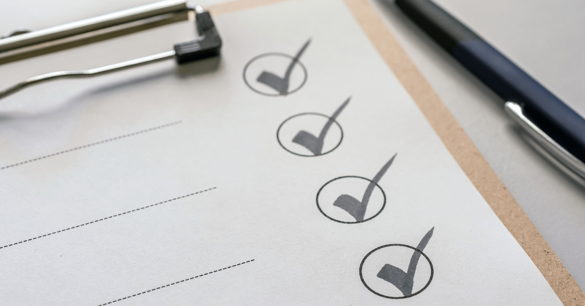 Four checkmarks on a piece of paper