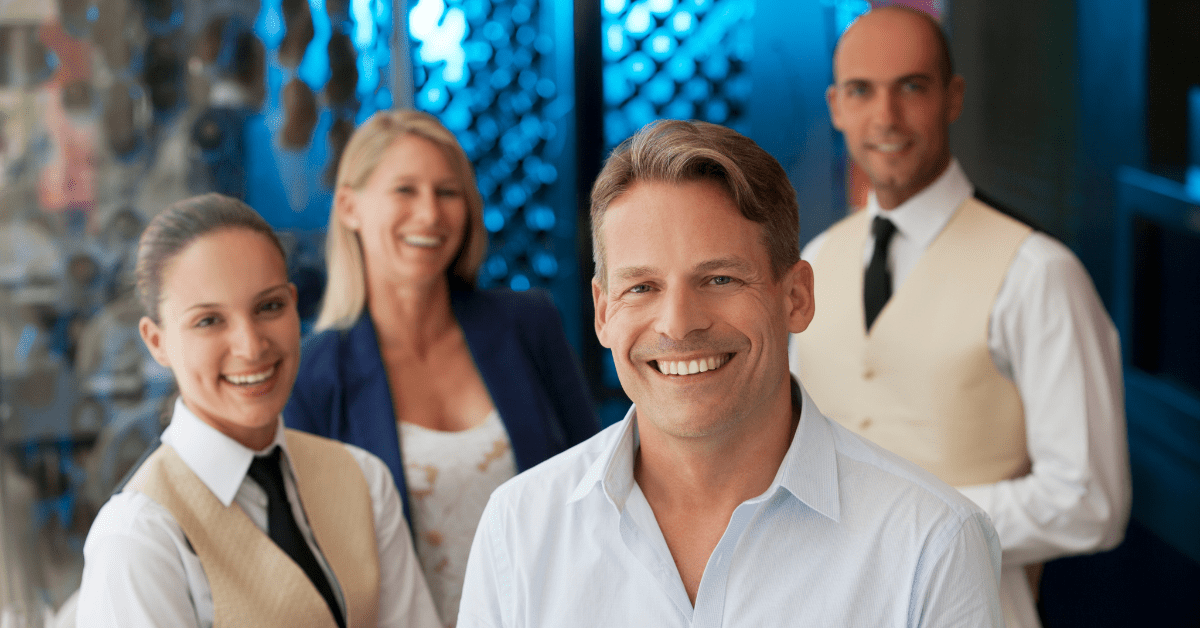 Four event staff, smiling