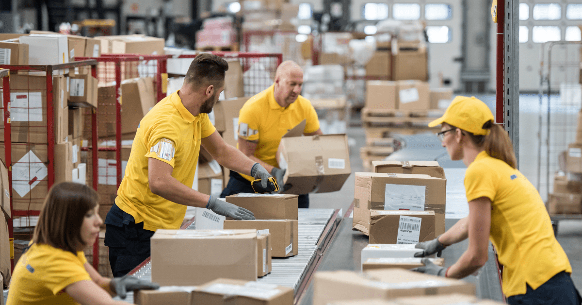 Warehouse workers packing boxes